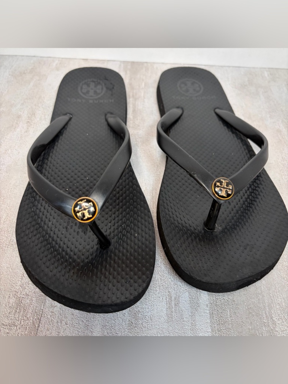 Tory Burch Black Flip Sandals with Gold Logo Medallions